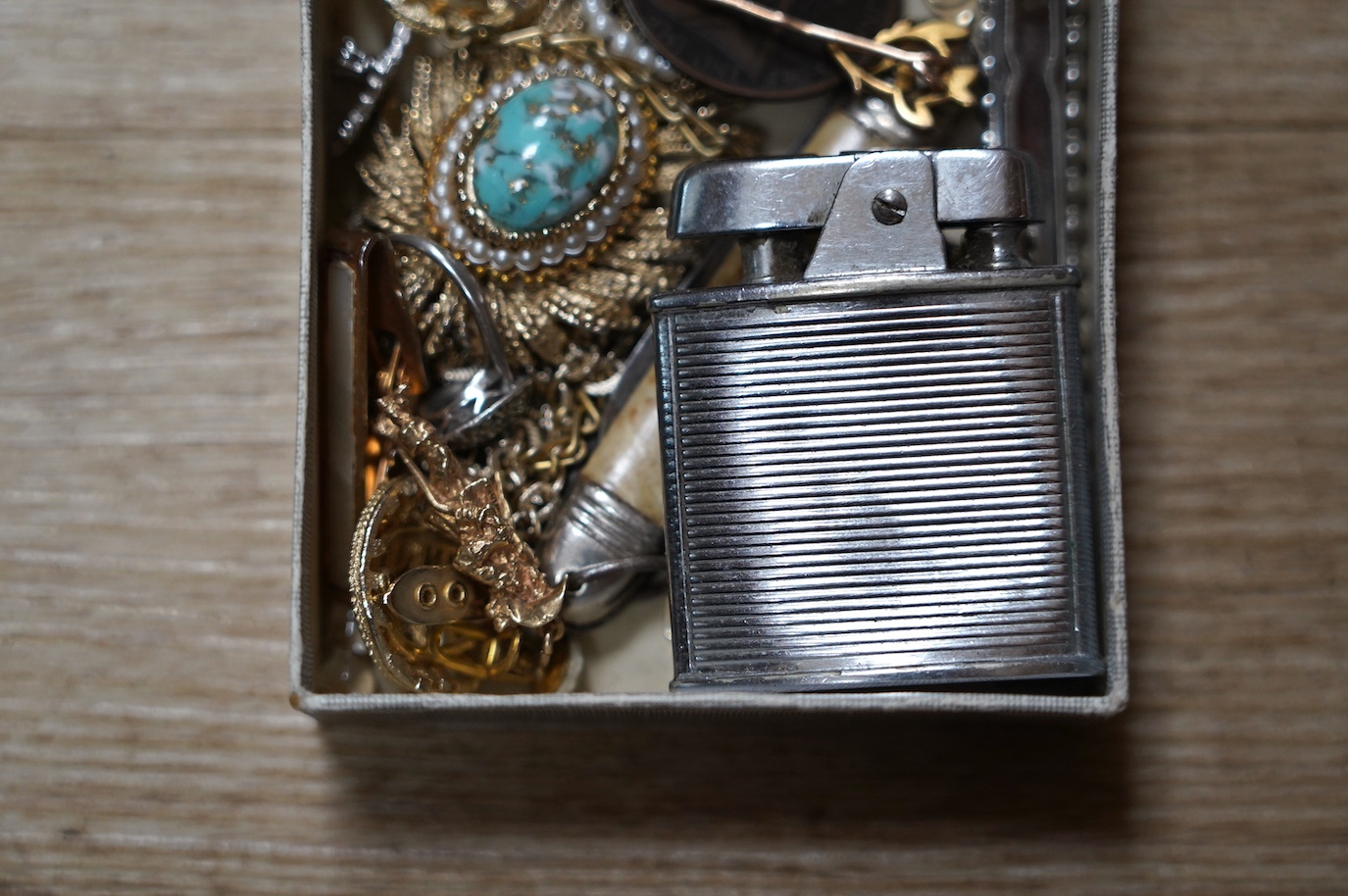 Assorted jewellery and other items including a 1970's 9ct gold Cavalier charm, 30mm, 5.9 grams, a 14k tram charm, 1.7 grams, a 9ct and enamel Esso badge, a yellow metal stick pin, marcasite and costume, lighter penknife,